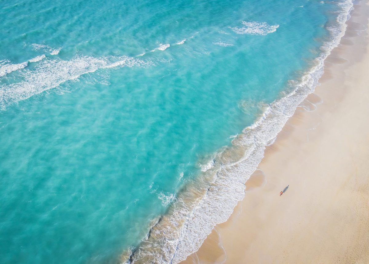 Saadiyat Island from above: the surf line where turquoise water meets pale sand
